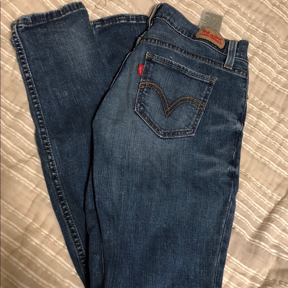Lighter wash Levi jeans